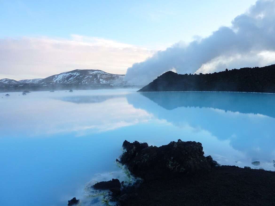 Scenic landscape of Icelandic mountains and a glacier lagoon at sunset