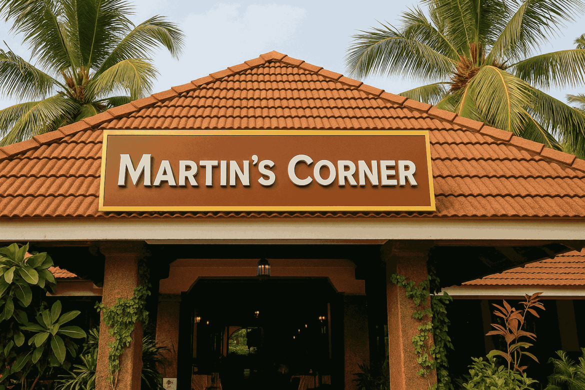 Front view of Martin’s Corner restaurant in Goa, featuring a red-tiled roof, tropical palm trees